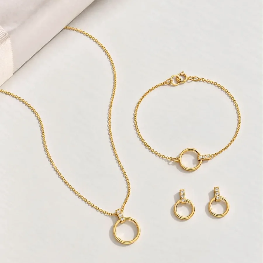Parure dorée : collier anneau, bracelet cercle et boucles d'oreilles assorties